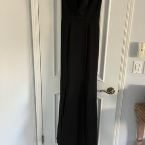 Formal black dress. Train in back.  Sz 4. NEW